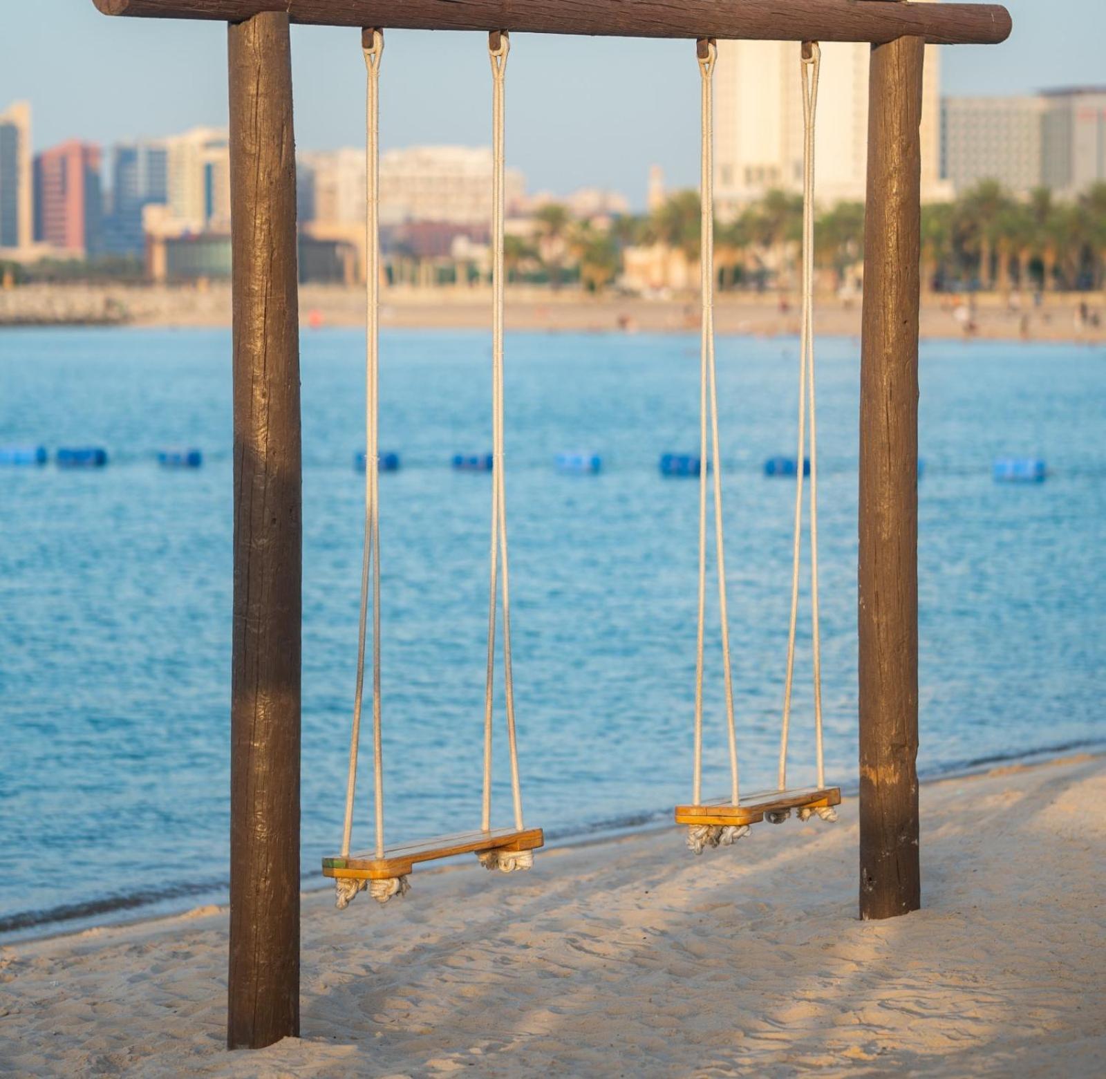 Marina Hotel Kuwait City Exterior foto Swinging bridge at Al-Shaab Beach